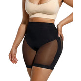 Black sheer mesh shapewear with beige top on a white background